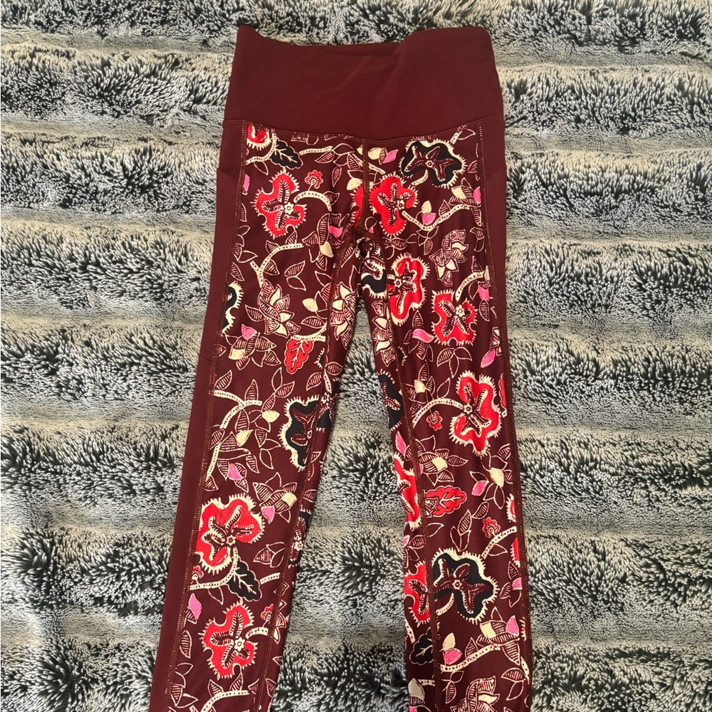 Athleta XS leggings. 75% Nylon 25% Lycra spandex. Maroon, pink, white dark blue